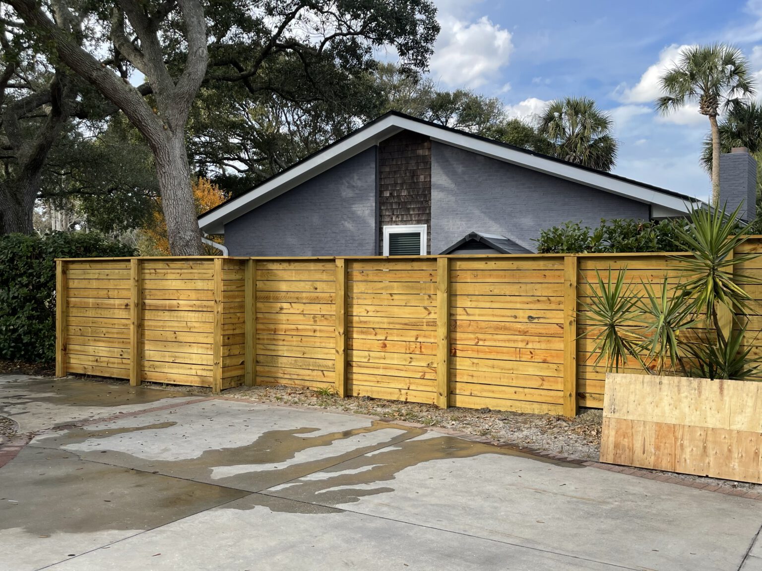 Horizontal cedar slat privacy fence at an Atlantic Beach home